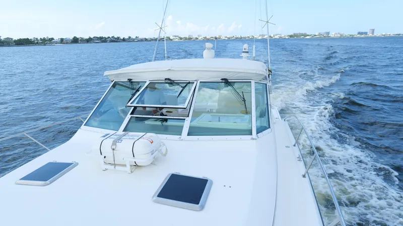 Extremely Clean Boat Yacht Photos Pics 2000 Tiara Yachts 3700 Open cruising on a calm blue sea.