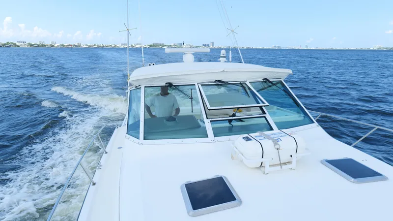 Extremely Clean Boat Yacht Photos Pics 2000 Tiara Yachts 3700 Open cruising on open water, clear sky in background.