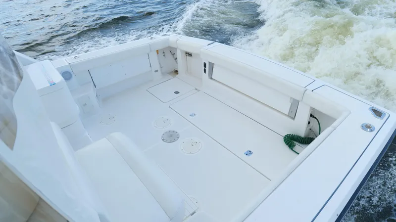 Extremely Clean Boat Yacht Photos Pics 2000 Tiara Yachts 3700 Open boat deck with white seating and ocean waves.