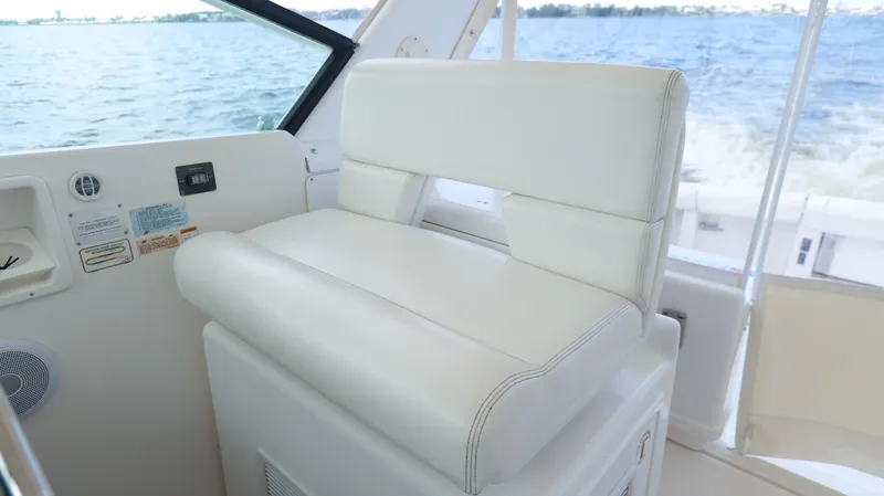 Extremely Clean Boat Yacht Photos Pics White captain's chair on 2000 Tiara Yachts 3700 Open, overlooking water.
