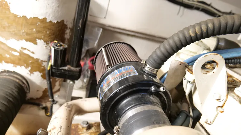 Extremely Clean Boat Yacht Photos Pics Engine compartment of a 2000 Tiara Yachts 3700 Open, featuring a detailed air filter.