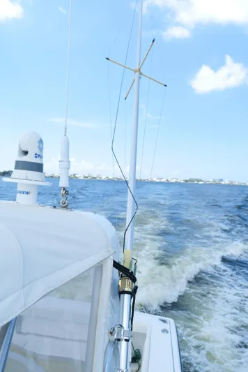 Extremely Clean Boat Yacht Photos Pics 2000 Tiara Yachts 3700 Open cruising on open water under clear blue skies.