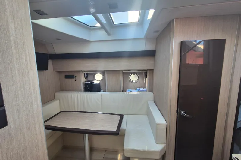  Yacht Photos Pics Interior of 2015 Cranchi M 44 HT yacht with seating area and skylight.
