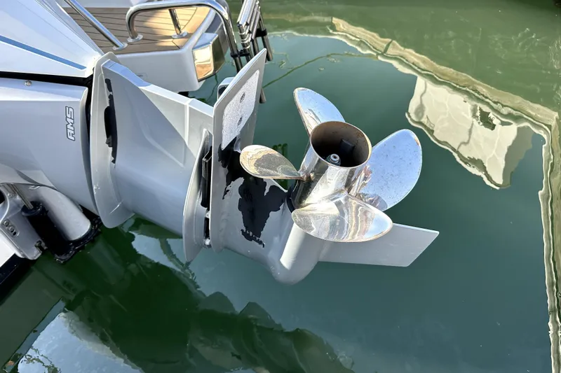 Mdr #187 In Stock Yacht Photos Pics Close-up of a 2023 Nimbus T11 boat propeller in water.