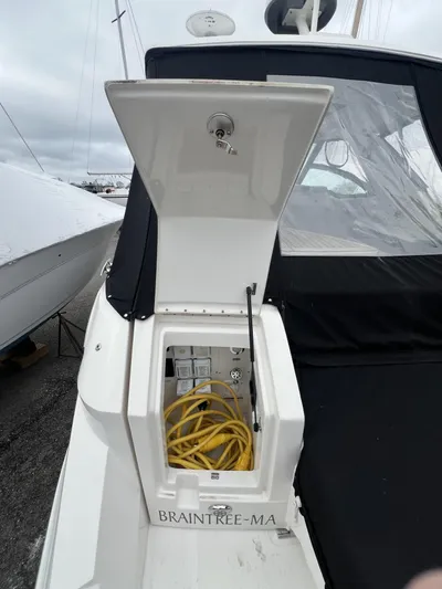  Yacht Photos Pics 2023 Sea Ray Sundancer 320 with open storage compartment and yellow cable, Braintree, MA.