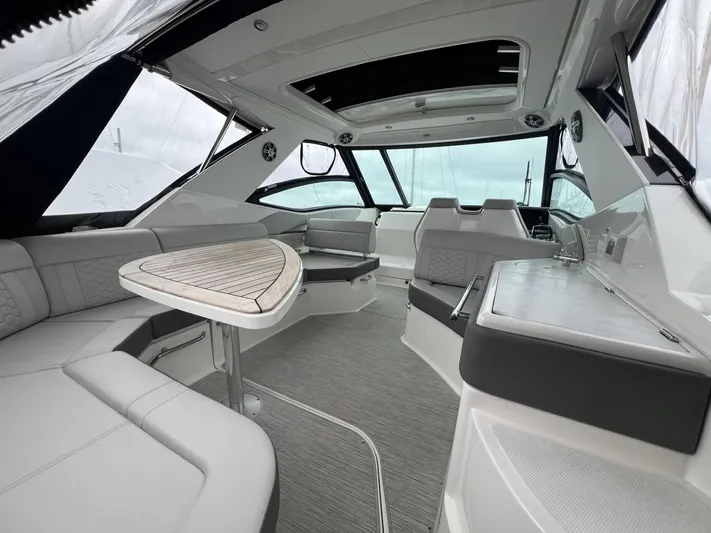  Yacht Photos Pics 2023 Sea Ray Sundancer 320 interior with sleek seating and modern design.