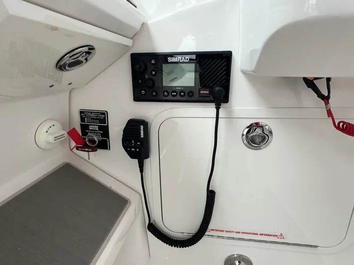  Yacht Photos Pics 2023 Sea Ray Sundancer 320 boat dashboard with Simrad marine radio equipment.