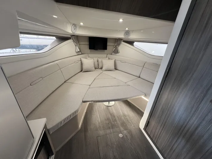  Yacht Photos Pics 2023 Sea Ray Sundancer 320 cabin interior with modern seating and sleek design.