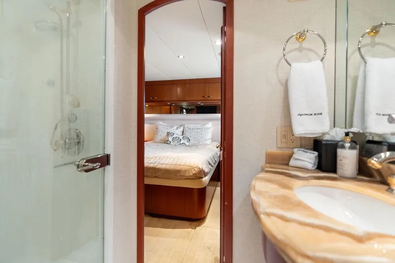 Magnum Ride Yacht Photos Pics Luxurious bathroom and bedroom on 2004 Hatteras 100 Motor Yacht.