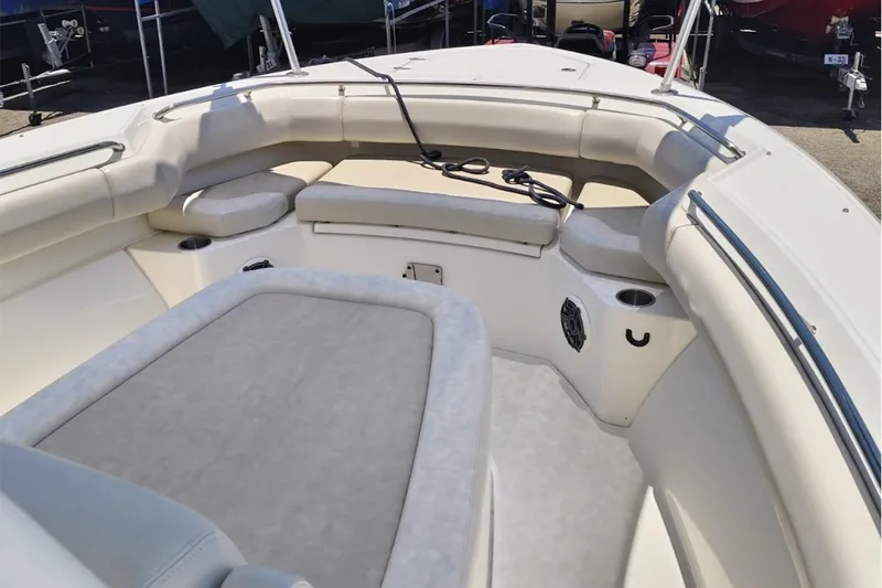 2024 Boston Whaler 280 Outrage @ Vallarta Yacht Photos Pics 2024 Boston Whaler 280 Outrage boat interior with cushioned seating and cup holders.
