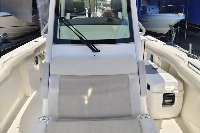 2024 Boston Whaler 280 Outrage @ Vallarta Yacht Photos Pics 2024 Boston Whaler 280 Outrage boat interior with seating and console view.