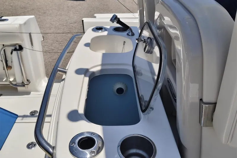 2024 Boston Whaler 280 Outrage @ Vallarta Yacht Photos Pics 2024 Boston Whaler 280 Outrage boat deck with sink and storage compartments.