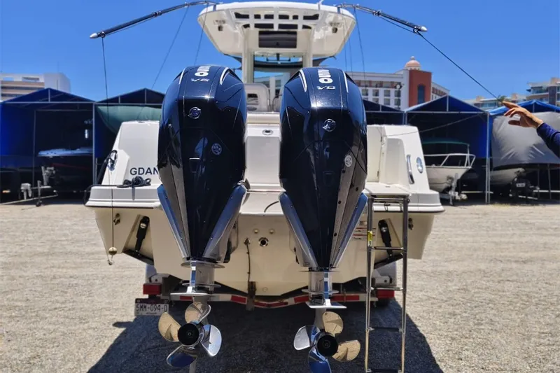 2024 Boston Whaler 280 Outrage @ Vallarta Yacht Photos Pics 2024 Boston Whaler 280 Outrage with dual outboard engines in a marina setting.