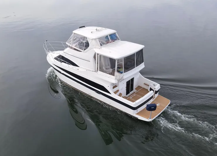 The Haven Yacht Photos Pics 2008 Carver 41 Cockpit Motor Yacht cruising on calm water.