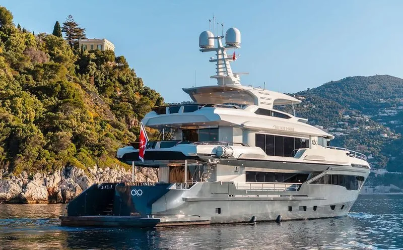 Infinity Nine Yacht Photos Pics Luxurious 2022 AvA Yachts Kando cruising near scenic coastline.