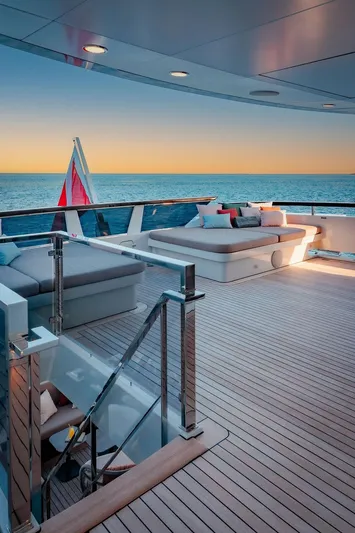Infinity Nine Yacht Photos Pics Luxurious 2022 AvA Yachts Kando deck with ocean view at sunset.