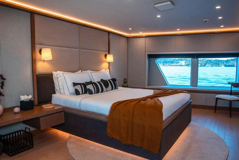Infinity Nine Yacht Photos Pics Luxurious 2022 AvA Yachts Kando bedroom with ocean view and elegant decor.