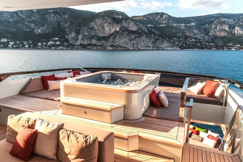 Infinity Nine Yacht Photos Pics Luxurious 2022 AvA Yachts Kando with jacuzzi, scenic ocean view, and plush seating.