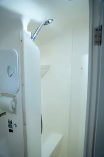  Yacht Photos Pics Shower area in 2017 Voyage Yachts VOYAGE 480, featuring sleek white design and modern fixtures.
