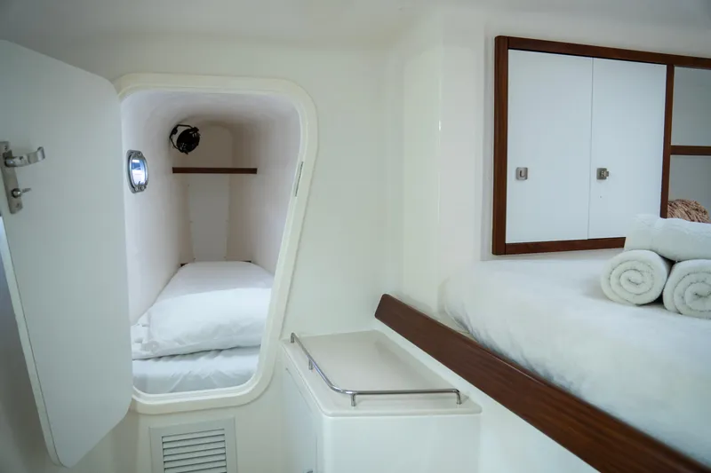  Yacht Photos Pics Luxurious cabin interior of 2017 Voyage Yachts VOYAGE 480 with cozy bedding.