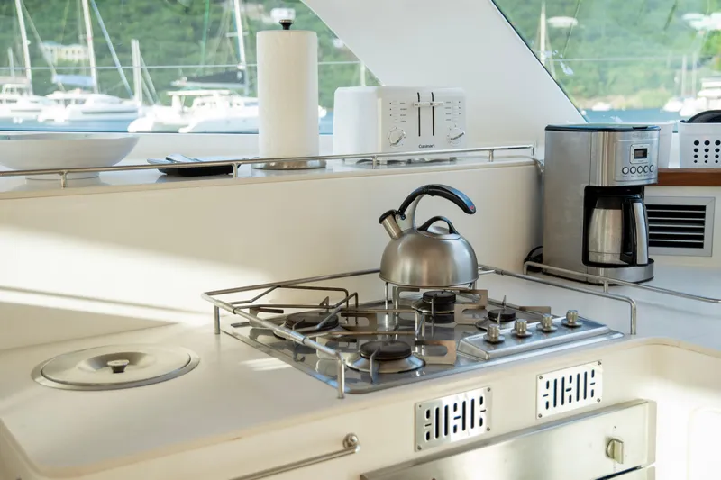  Yacht Photos Pics Modern kitchen on 2017 Voyage Yachts VOYAGE 480, featuring stove and coffee maker.