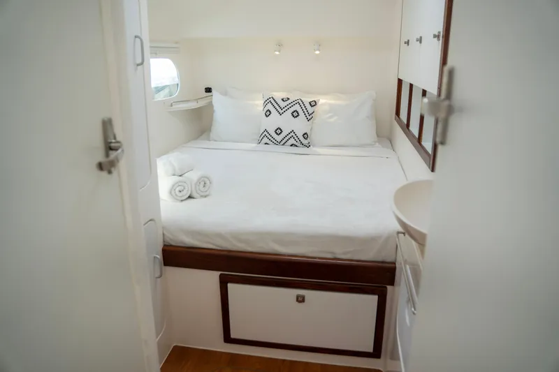  Yacht Photos Pics Cozy bedroom in 2017 Voyage Yachts VOYAGE 480, featuring a neatly made bed and modern decor.