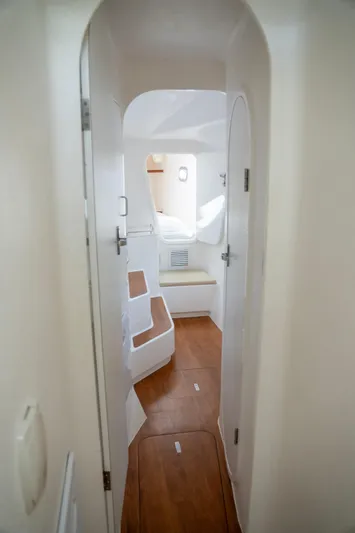  Yacht Photos Pics Interior view of 2017 Voyage Yachts VOYAGE 480, featuring sleek white design and wooden flooring.