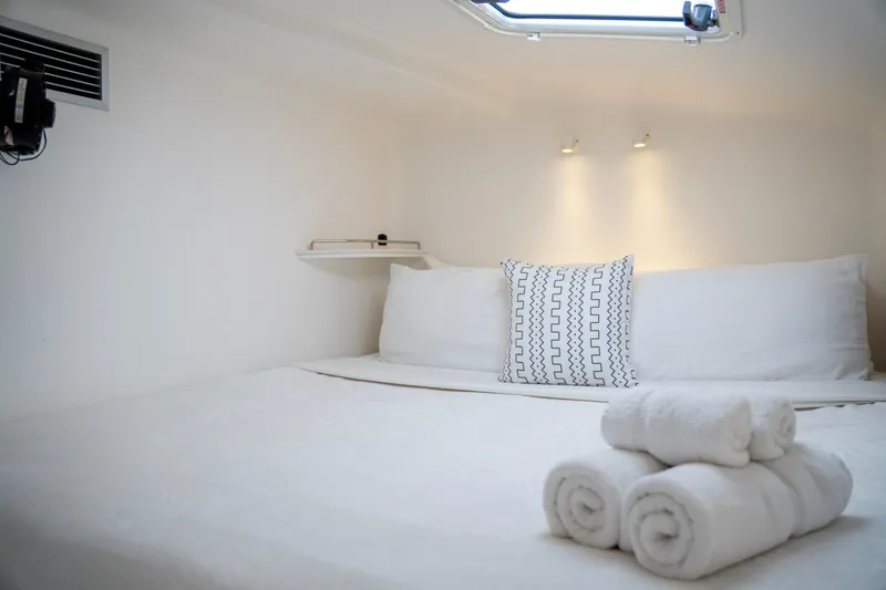  Yacht Photos Pics Luxurious cabin interior of 2017 Voyage Yachts VOYAGE 480 with neatly arranged towels.