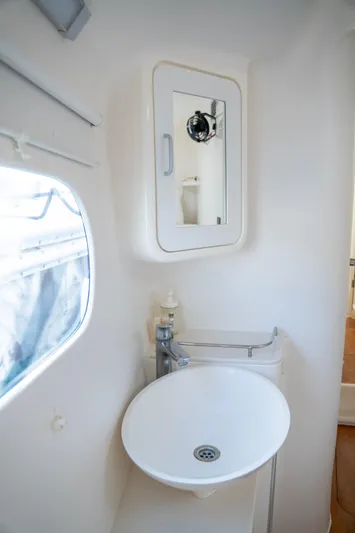 Yacht Photos Pics Modern bathroom in 2017 Voyage Yachts VOYAGE 480, featuring sleek sink and mirror.
