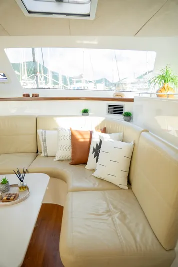  Yacht Photos Pics Luxurious interior of 2017 Voyage Yachts VOYAGE 480 with plush seating and decorative pillows.