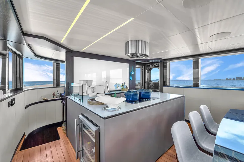  Yacht Photos Pics Luxurious interior of 2021 OKEAN 80 yacht with modern kitchen and ocean view.