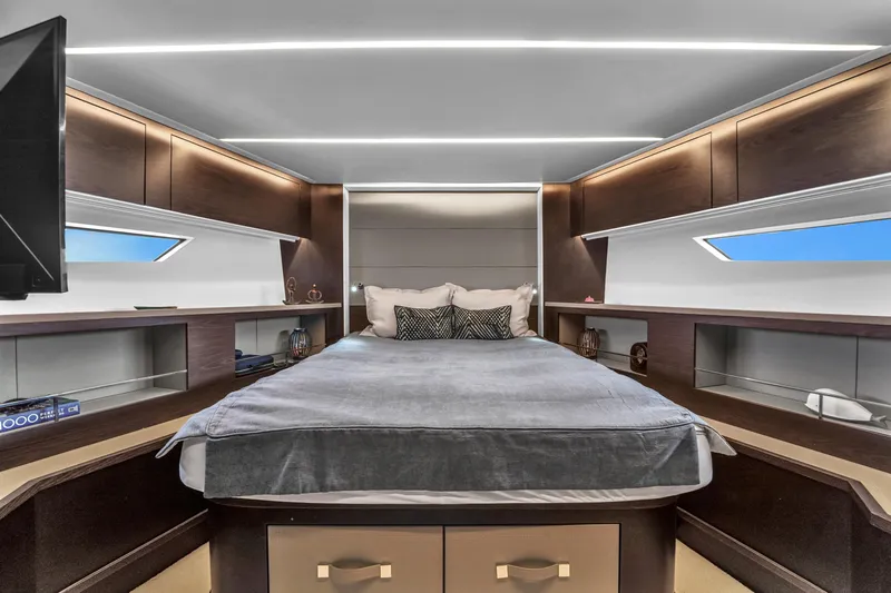  Yacht Photos Pics Luxurious bedroom interior of 2021 OKEAN 80 yacht with modern design and ambient lighting.