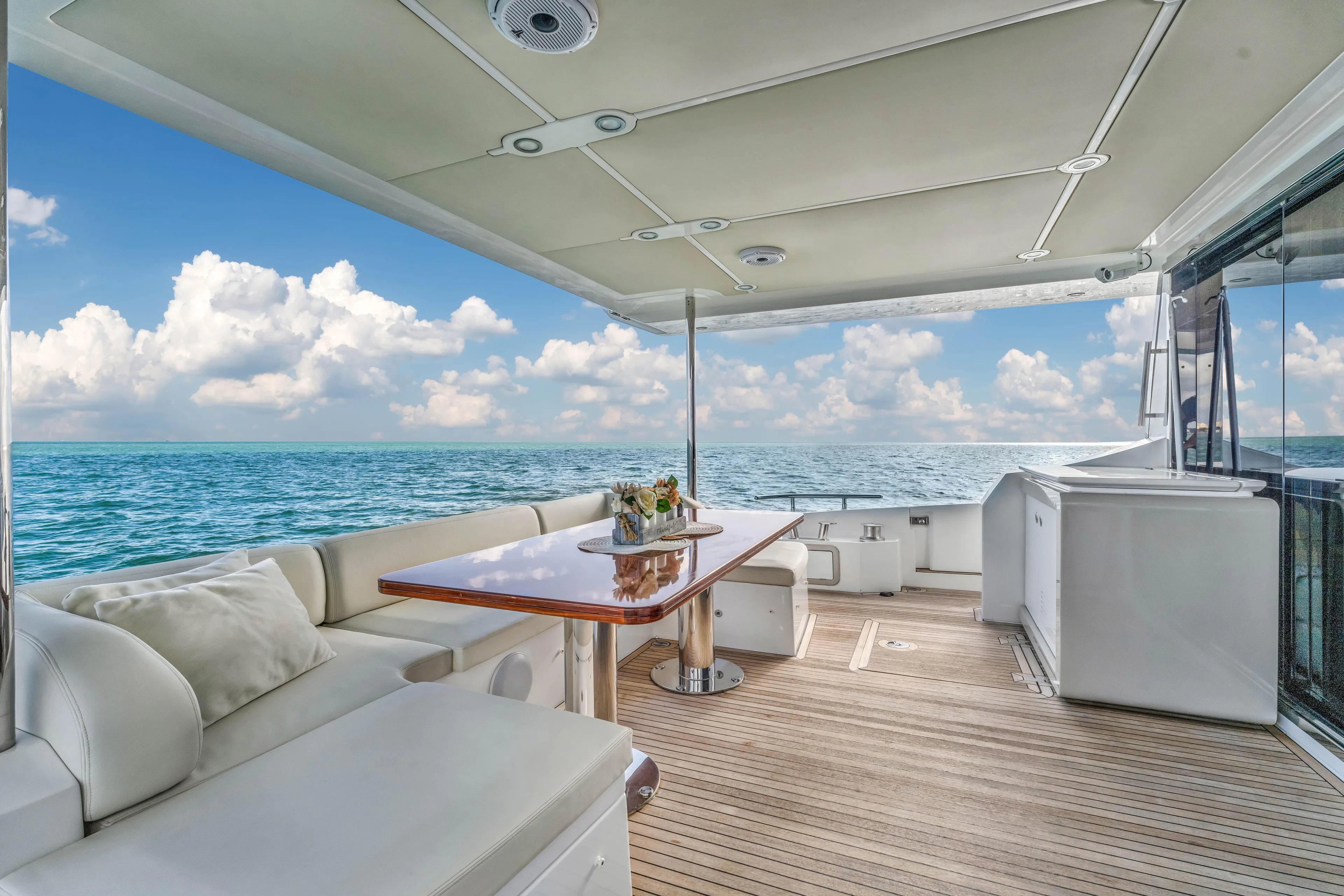 Mancusa Yacht Photos Pics Azimut Fly 72 yacht deck, 2016 model, with ocean view and luxurious seating.