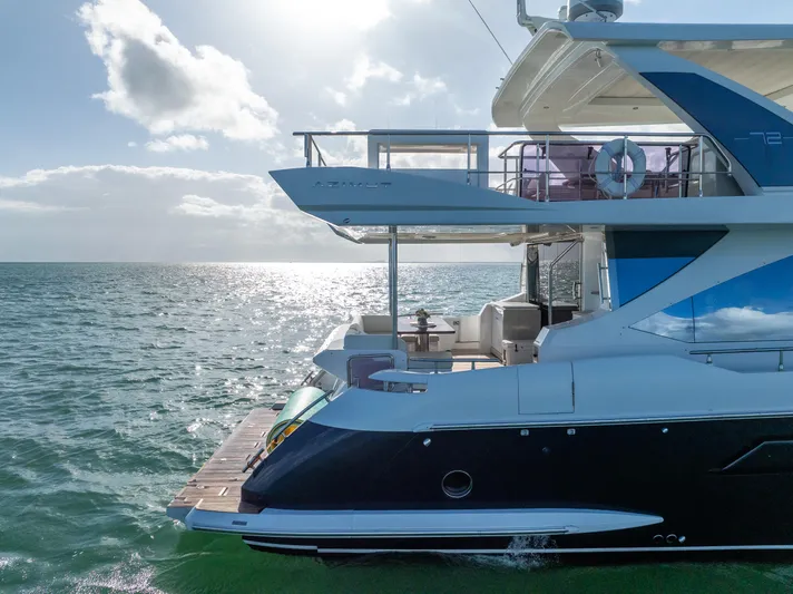 Mancusa Yacht Photos Pics Azimut Fly 72 yacht, 2016 model, cruising on open water under a bright sky.