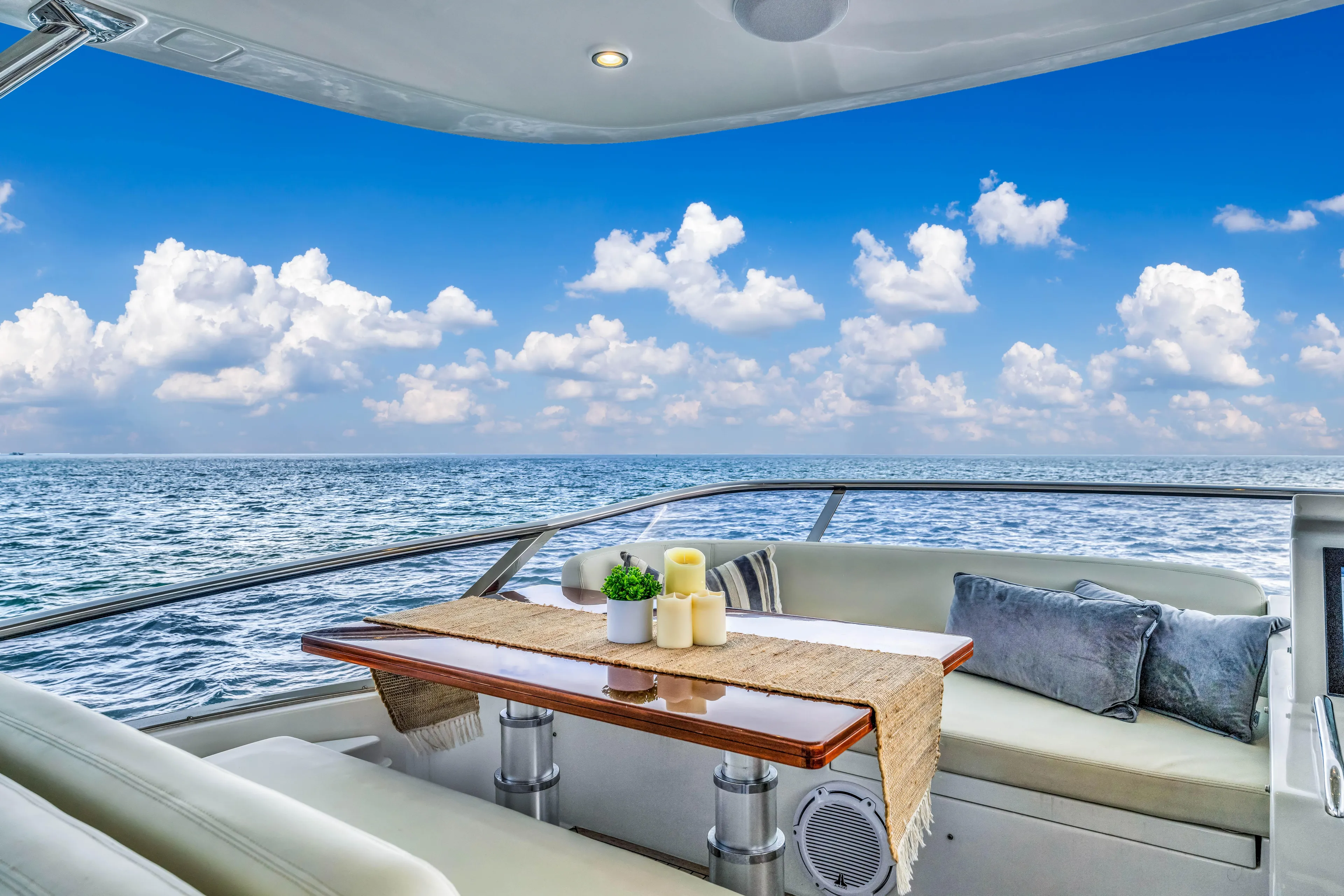 Mancusa Yacht Photos Pics Luxurious Azimut Fly 72 yacht deck with ocean view, featuring elegant seating and table setup.