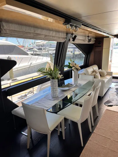 Mancusa Yacht Photos Pics Luxurious interior of 2016 Azimut Fly 72 yacht with elegant dining area.