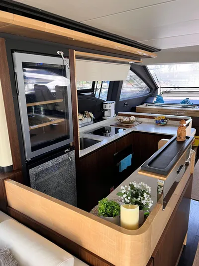 Mancusa Yacht Photos Pics Luxurious interior of a 2016 Azimut Fly 72 yacht, featuring a modern kitchen design.