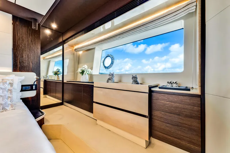 Mancusa Yacht Photos Pics Luxurious interior of 2016 Azimut Fly 72 yacht with elegant furnishings and large window view.