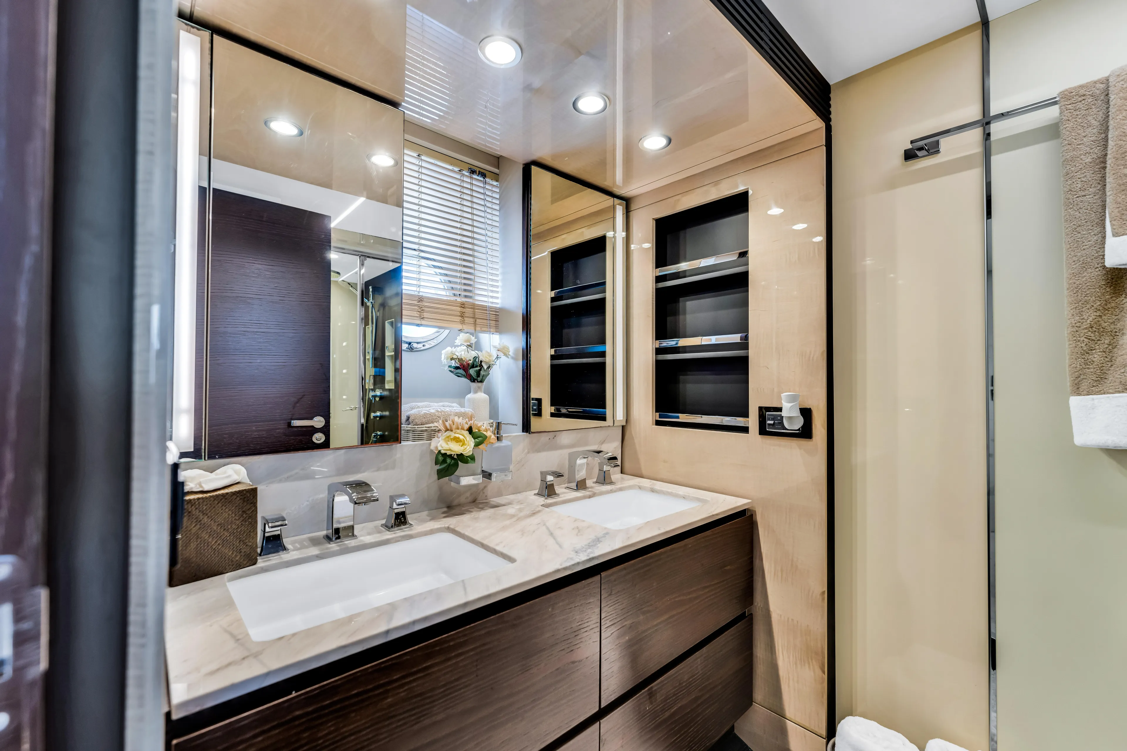 Mancusa Yacht Photos Pics Luxurious bathroom interior of 2016 Azimut Fly 72 yacht with dual sinks and modern design.