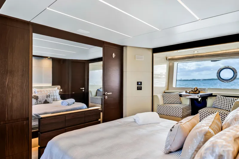Mancusa Yacht Photos Pics Luxurious bedroom interior of 2016 Azimut Fly 72 yacht with ocean view.