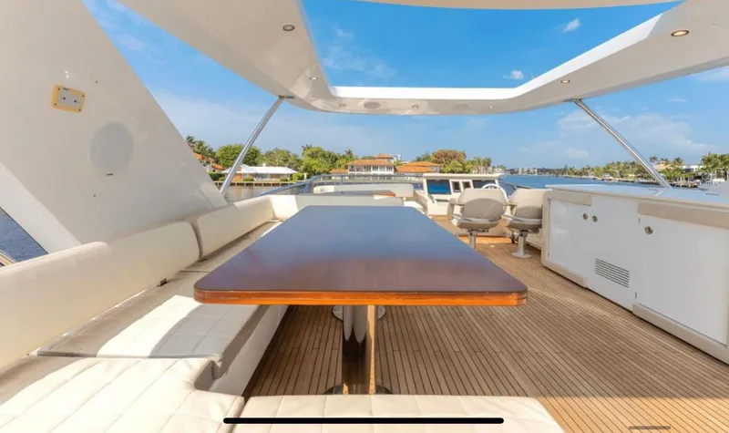 Mancusa Yacht Photos Pics Azimut Fly 72 yacht deck, 2016 model, featuring spacious seating and a wooden table.
