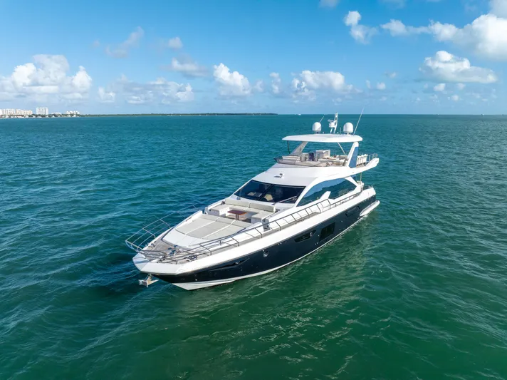 Mancusa Yacht Photos Pics Azimut Fly 72 yacht, 2016 model, cruising on open sea under clear skies.
