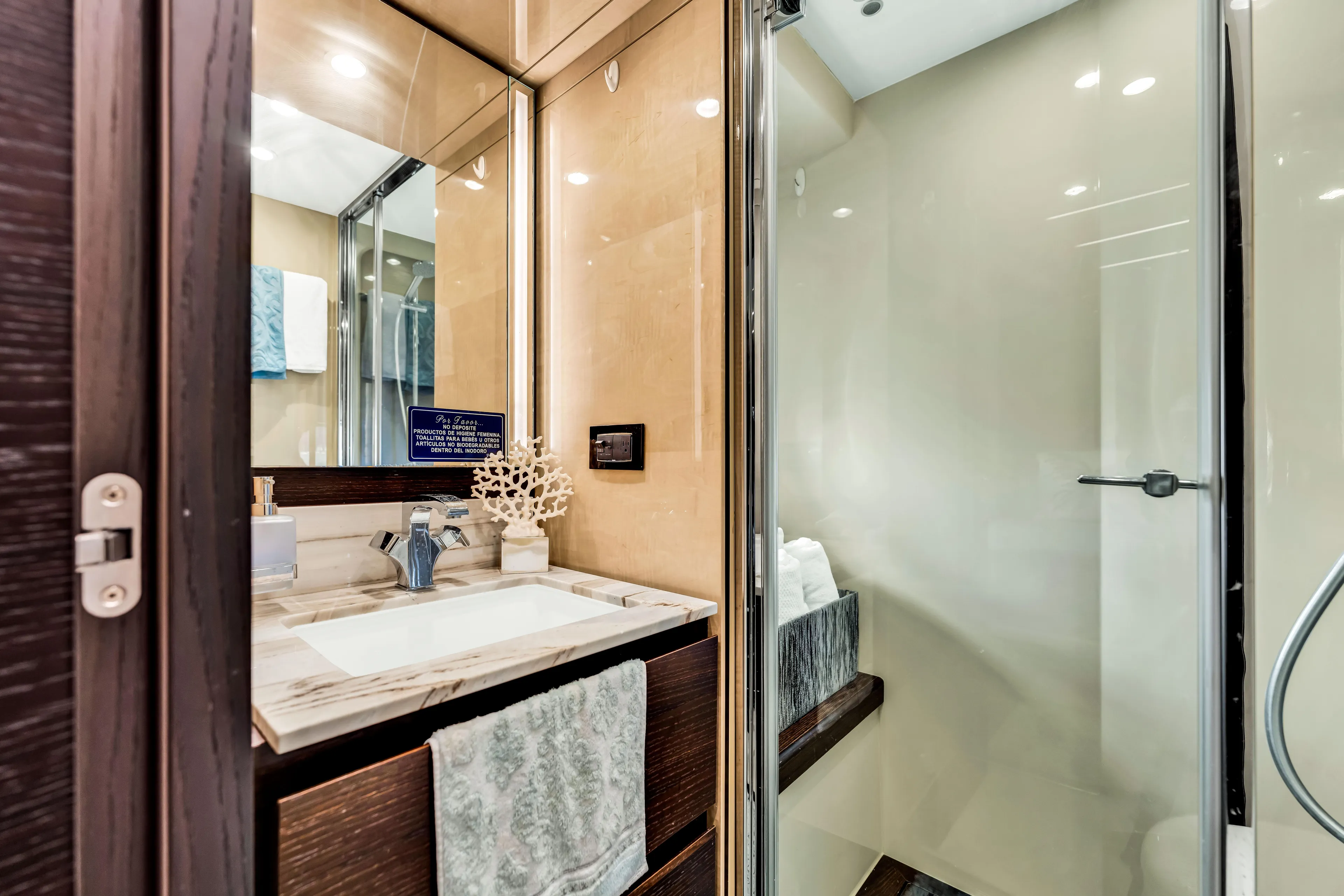 Mancusa Yacht Photos Pics Luxurious bathroom in 2016 Azimut Fly 72 yacht, featuring modern fixtures and elegant design.