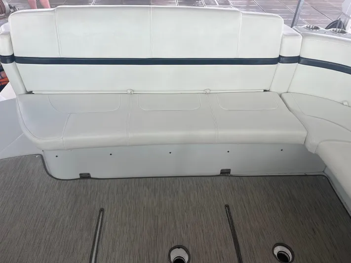  Yacht Photos Pics 2014 Formula 45 Yacht interior seating with white upholstery and gray flooring.