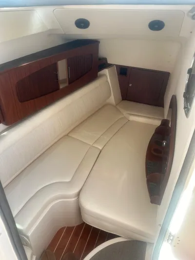 V5 Yacht Photos Pics 2019 Grady-White Freedom 375 cabin interior with white seating and wooden accents.