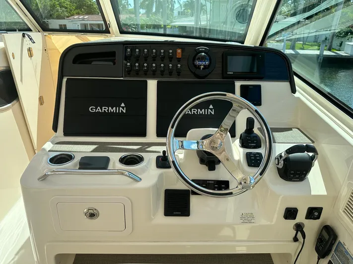 V5 Yacht Photos Pics 2019 Grady-White Freedom 375 helm with Garmin navigation and control systems.