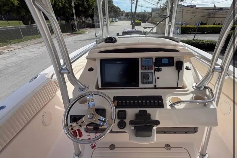  Yacht Photos Pics 2007 Grady-White Bimini 306 boat console with steering wheel and navigation equipment.