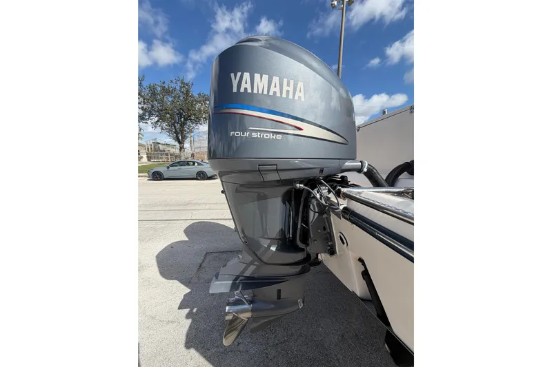  Yacht Photos Pics Yamaha four-stroke outboard motor on 2007 Grady-White Bimini 306 boat, sunny day.
