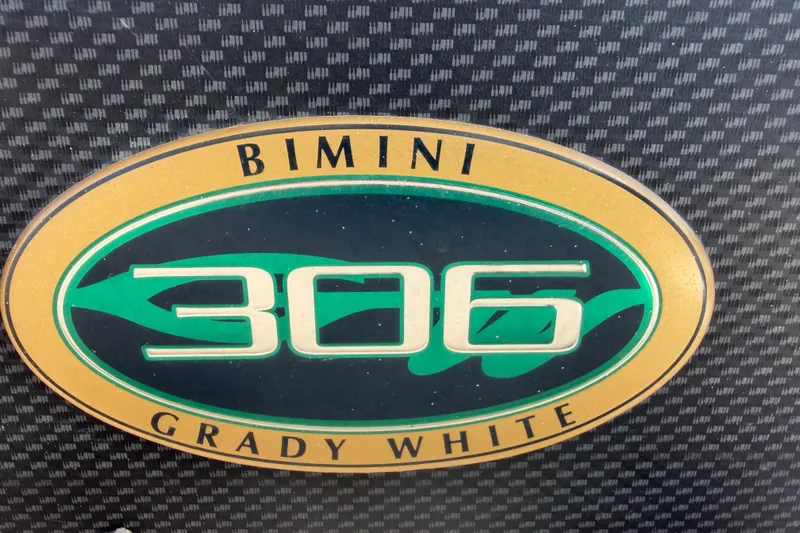  Yacht Photos Pics Grady-White Bimini 306 logo on textured background, 2007 model.