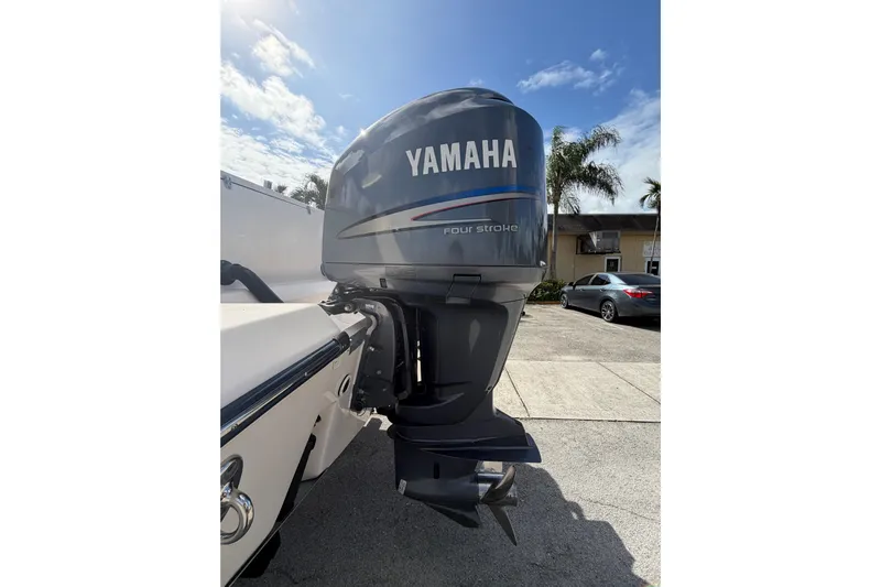  Yacht Photos Pics 2007 Grady-White Bimini 306 with Yamaha four-stroke outboard motor in sunny driveway.
